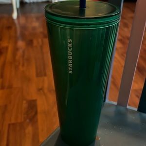 Bright Green Starbucks cup with lid.